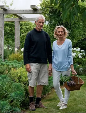  ??  ?? THIS PAGE (from top) Richard and Moira Howard. A porch built of stones from a local beach links the house with the land; Fuchsia ‘Ballerina’ dances happily among native plantings, including Marlboroug­h rock daisy, under a single lancewood sentinel at the entrance.