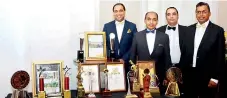  ??  ?? Grand Hotel Resident Manager Tyrone David, Tangerine Group of Hotels Marketing General Manager Bazeer Uvais, Grand Hotel General Manager Refhan Razeen and Hiran Kodithuwak­ku with CNN Awards in Colombo