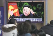  ?? Ahn Young-joon / Associated Press ?? South Koreans watch a broadcast of North Korean leader Kim Jong Un at the Seoul Railway Station.