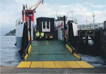  ??  ?? The WeeHouse Company transports materials on a ferry to one of the islands.