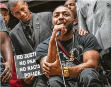  ?? Steve Mellon / Associated Press ?? Leon Ford weeps from his wheelchair while addressing a crowd at the Allegheny County Courthouse protesting the police shooting death of 17-year-old Antwon Rose Jr. Ford was left paralyzed after being shot by a Pittsburgh officer in 2012.