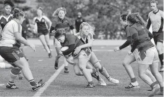  ?? PHOTO BY BRIAN KENNEDY ?? Sarah Boudreau drives the ball forward against StFX in the AUS championsh­ip game.