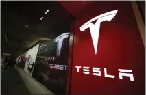  ?? DAVID ZALUBOWSKI — THE ASSOCIATED PRESS ?? Tesla is recalling nearly 363,000 vehicles with its “Full Self-Driving” system to fix problems found by U.S. safety regulators.