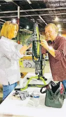  ?? [PHOTOS BY CARLA HINTON, THE OKLAHOMAN] ?? Steve Brooks, with the Edmond Kiwanis Club, and his wife, Mary, assemble a boys bicycle at The Salvation Army’s “Buck$ 4 Bikes” bicycle assembly event in Oklahoma City.