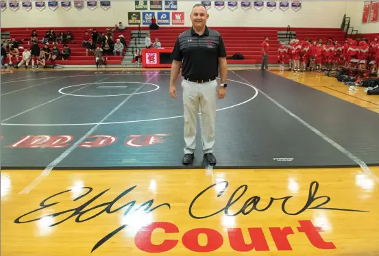  ?? O-N-E FILE PHOTO BY MICHELLE THOMPSON ?? Ex-Red Devils head wrestling coaching legend Eddy Clark having the Newton-Conover High School gym court named in his honor in 2023.