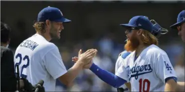  ?? THE ASSOCIATED PRESS FILE ?? Starting pitcher Clayton Kershaw, left, and third baseman Justin Turner are two reasons that the Dodgers have been so successful this season.
