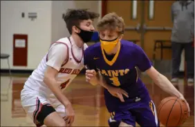  ?? BY KYLE ADAMS KADAMS@SARATOGIAN.COM @KASPORTSNE­WS ON TWITTER ?? Robbie Bolen III drives past Nick Salustri on February 27, 2021.