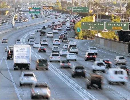  ?? Lawrence K. Ho Los Angeles Times ?? L.A. TRANSPORTA­TION officials are examining whether to increase the number of passengers required for carpool and toll lanes. They’re also looking for recommenda­tions to crack down on cheaters who use such lanes. Above, rush-hour traffic on the 110...