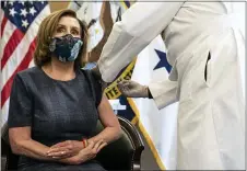  ?? ANNA MONEYMAKER — THE NEW YORK TIMES VIA AP ?? Speaker of the House Nancy Pelosi, D-Calif., receives a Pfizer-BioNTech COVID-19 vaccine shot by Dr. Brian Monahan, attending physician of the Congress of the United States in Washington, Friday, Dec. 18, 2020.