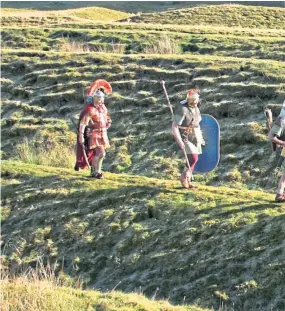  ?? Nicolson. Picture: Dougie ?? Members of the Antonine Guard, a Roman re-enactment group, at Ardoch fort, Braco.