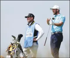  ?? Associated Press ?? DEBUT — England’s Nicholas Poppleton reacts after playing from the 8th tee during a practice round for the British Open Golf Championsh­ip at Royal St George’s golf course Sandwich, England on Tuesday. The Open starts Thursday.