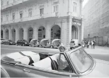  ?? REBECCA BLACKWELL, AP ?? Taxi drivers wait outside hotels in Havana.