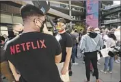  ?? Al Seib Los Angeles Times ?? NETFLIX employees, activists and their supporters gathered at a protest in Hollywood in October 2021.