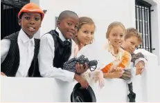  ?? Picture: FREDLIN ADRIAAN ?? BACK TO THE FUTURE: St George’s Preparator­y School pupils, from left, Paige Thomson, Diya Gajjar, Julia Swart and Bongo Tshayingwe dressed in Victorian outfits for a visit to No 7 Castle Hill museum last week