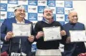  ?? MOHD ZAKIR/HT PHOTO ?? (From Left) AAP’S RS candidates Sushil Gupta, Sanjay Singh and ND Gupta with their 'Certificat­e of Election'.