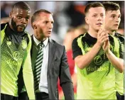  ??  ?? Brendan Rodgers walks off with players