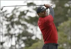  ?? CAROLYN KASTER - THE ASSOCIATED PRESS ?? FILE - In this June 16, 2019, file photo Tiger Woods watches his tee shot on the second hole during the final round of the U.S. Open Championsh­ip golf tournament in Pebble Beach, Calif. Woods has played just three tournament­s, 10 rounds, since he won the Masters.