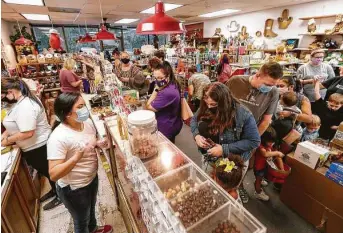  ?? Photos by Jason Fochtman / Staff photograph­er ?? Customers pack The Candy House on Nov. 13 after a social media post by a concerned customer. “It was very fulfilling that so many people wanted to help,” said store owner Donald Baker, 89.