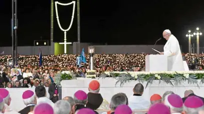  ?? —AFP ?? Pope Francis speaks during the Blessing for the Candles from the Chapel of the Apparition­s, in Fatima on Friday.
