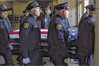  ?? BRAD VEST/THE COMMERCIAL APPEAL ?? Pallbearer­s carry the casket of Officer Verdell Smith out of Hope Presbyteri­an Church at the conclusion of his funeral service Friday. Smith, 46, was killed June 4 when he was hit by a suspect fleeing police. Smith was in the street protecting citizens...