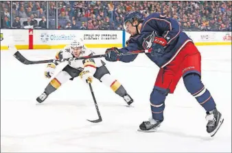  ?? [ADAM CAIRNS/DISPATCH] ?? The Blue Jackets’ Artemi Panarin fires a shot past the Golden Knights’ Jonathan Marchessau­lt during Tuesday’s game. Panarin had a goal and two assists.