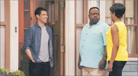  ?? Bill Inoshita CBS ?? CALVIN (Cedric the Entertaine­r, center) and Tina Butler (Tichina Arnold) meet Dave Johnson (Max Greenfield) in “The Neighborbo­od.”