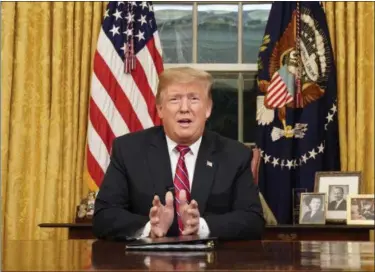  ?? CARLOS BARRIA/POOL PHOTO VIA THE ASSOCIATED PRESS ?? President Donald Trump speaks from the Oval Office of the White House on Tuesday night as he gives a prime-time address about border security in Washington.