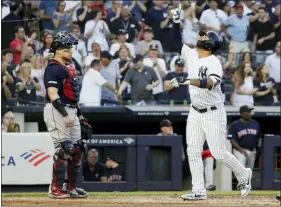  ?? FRANK FRANKLIN II — THE ASSOCIATED PRESS ?? The Yankees’ Gleyber Torres, right, celebrates after hitting a grand slam, next to Red Sox catcher Christian Vazquez during the first inning Friday in New York.