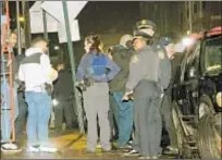  ?? VIC NICASTRO ?? Officers at scene outside nightspot on Anthony Ave. in the Bronx after early Saturday gunfire.