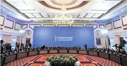  ?? Kirill Kudryavtse­v / AFP ?? Representa­tives of Syria’s regime and rebel factions meet at the first session of the peace talks in Astana yesterday.