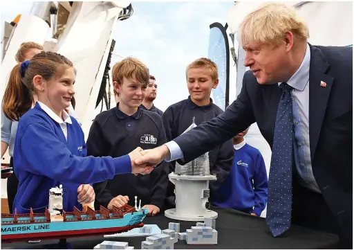  ??  ?? Shaky start...the Prime Minister meets a group of schoolchil­dren onboard NLV Pharos to mark London Internatio­nal Shipping Week