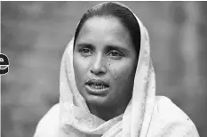  ??  ?? Bushra Bibi, 30, who sold one of her kidneys, cries as she speaks during an interview with AFP at her home in Bhalwal.