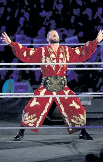  ?? GEORGE TAHINOS/SLAM! WRESTLING ?? World Wrestling Entertainm­ent superstar and former NXT champion Bobby Roode of Peterborou­gh enters the ring at the Barclays Center during SummerSlam weekend in Brooklyn, N.Y., last month. Roode lost his championsh­ip to Drew McIntyre at NXT Takeover:...