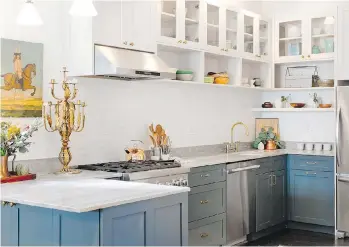  ?? HOUZZ ?? Although white will always be a classic colour for kitchen design, homeowners are injecting rich colours such as warm wood tones and neutrals such as greys and blues.