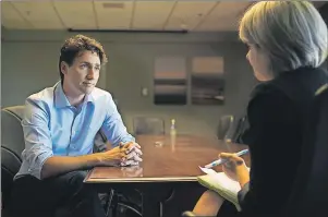  ?? NATHAN ROCHFORD/THE GUARDIAN ?? Prime Minister Justin Trudeau sits down for a one-on-one interview with Guardian reporter Teresa Wright at the Charlottet­own Airport on Thursday.