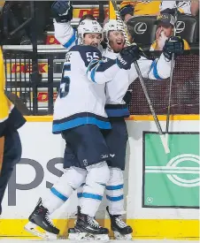  ?? FREDERICK BREEDON/GETTY IMAGES ?? The Jets’ Mark Scheifele and Kyle Connor gave the Predators headaches Saturday in Game 5 of their series.