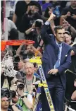  ?? CHRIS COVATTA/GETTY IMAGES ?? Head coach Jay Wright of the Villanova Wildcats cuts down the net after defeating the Michigan Wolverines on Monday.