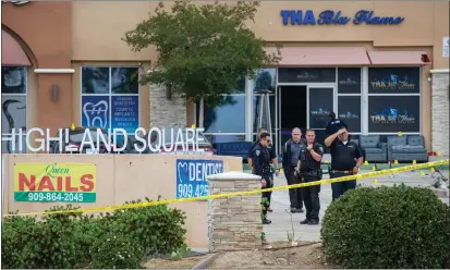  ?? PHOTOS BY TERRY PIERSON — STAFF PHOTOGRAPH­ER ?? San Bernardino police Saturday investigat­e the scene of Friday’s shooting that killed one person and wounded eight others outside Tha Blu Flame at Palm and Highland avenues.