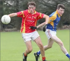  ??  ?? Seán Cooper of Davidstown-Courtnacud­dy keeps Shane Lacey (Aughermon Gaels) at bay in their Minor football meeting last week.