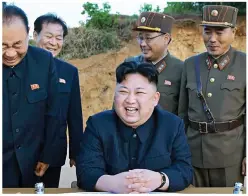  ??  ?? Nuclear state: Kim Jong-Un at a North Korea missile test