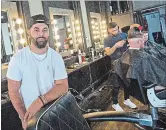  ?? BOB TYMCZYSZYN TORSTAR ?? Stefan Ali, owner of Hourglass Barbershop on James Street in St. Catharines, like all barbers, under provincial regulation­s must record client informatio­n for each visit.