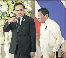  ?? [THE ASSOCIATED PRESS FILE PHOTO] ?? Philippine President Rodrigo Duterte, right, and Thailand’s Prime Minister Prayuth Chan-ocha leave a news conference in Bangkok, Thailand, on March 21. President Donald Trump has invited both to the White House, despite human-rights concerns in their...