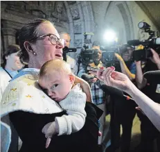  ?? SEAN KILPATRICK THE CANADIAN PRESS ?? Democratic Institutio­ns Minister Karina Gould carries her three-month-old baby boy, Oliver, following a cabinet meeting on Parliament Hill on Tuesday.