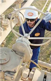  ?? KRISENERGY ?? A KrisEnergy employee operates equipment at the Block 9 onshore gas field in Bangladesh. The company says it has undertaken a process to divest certain assets.