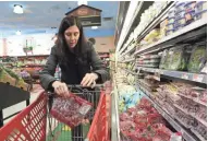  ?? JOHN MEORE/THE JOURNAL NEWS ?? Researcher­s conducted field experiment­s to see why consumers pay more for certain foods with perceived premium labeling.