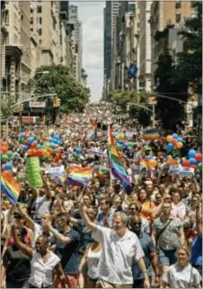  ?? ANDRES KUDACKI — THE ASSOCIATED PRESS ?? New York City Mayor Bill de Blasio, bottom center, marches during the New York City Pride Parade on Sunday in New York.