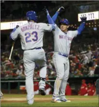  ?? PABLO MARTINEZ MONSIVAIS — THE ASSOCIATED PRESS ?? Asdrubal Cabrera (13) celebrates solo homer with teammate Adrian Gonzalez during Mets’ victory over Nationals on Sunday night.