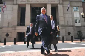  ?? Jacquelyn Martin / Associated Press ?? The defense team for Paul Manafort, including Thomas Zehnle, center, and Jay Nanavati, right, leave federal court Thursday for a lunch break during the trial.