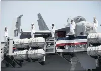  ?? PICTURE: EPA ?? Sailors man the rails of the aircraft carrier USS Gerald R Ford during its commission­ing in Norfolk, Virginia on Saturday.