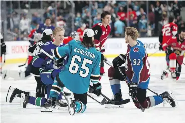  ?? EZRA SHAW/GETTY IMAGES ?? Three Swedes, Elias Pettersson, left, San Jose’s Erik Karlsson and Colorado’s Gabriel Landeskog, at Saturday’s All-Star skills competitio­n.